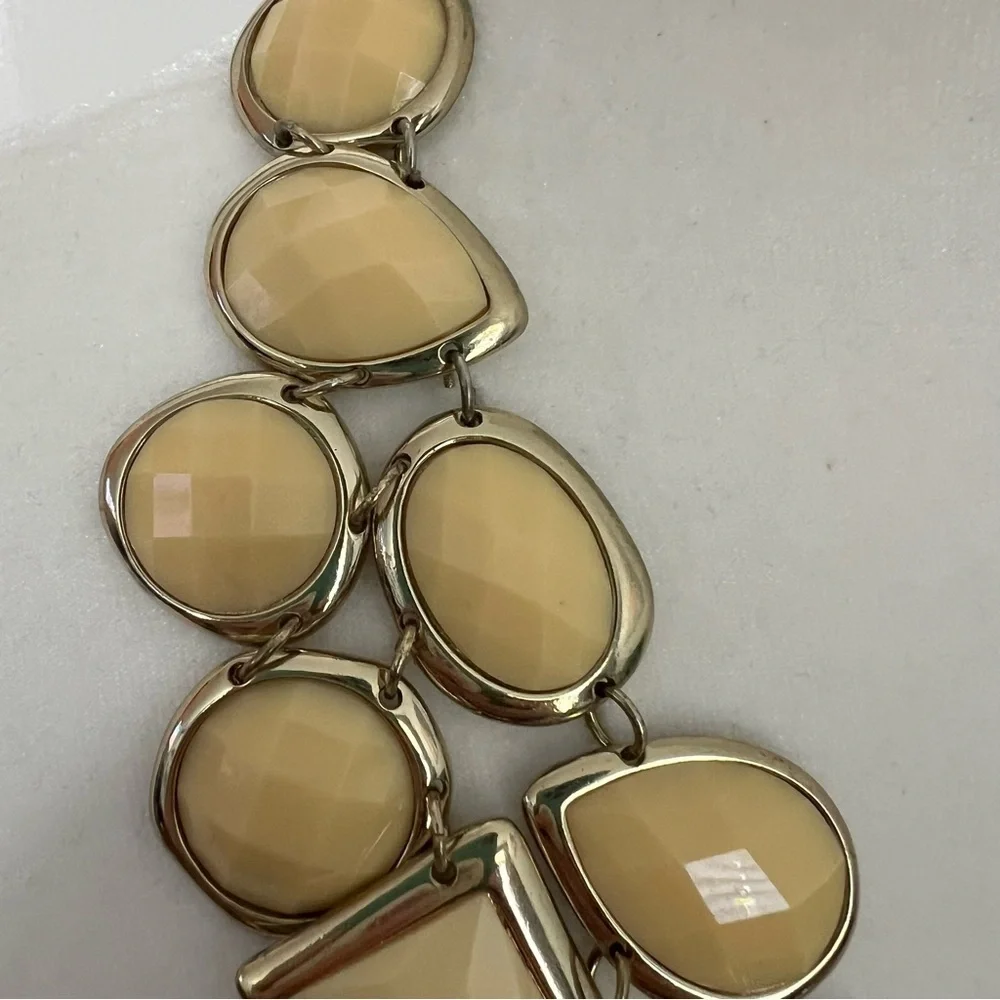 Cream colored faceted bead statement dramatic bib necklace on gold tone chain